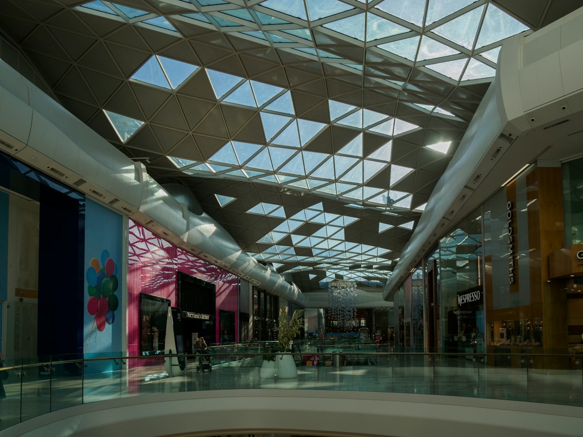 Glass roof and retail storefronts in Westfield London